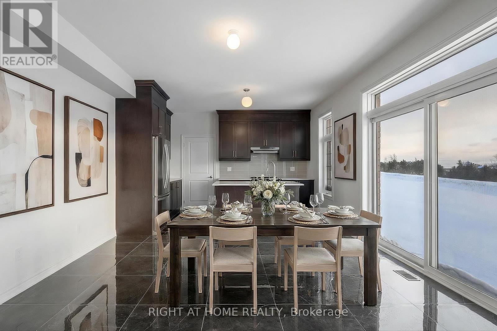 Kitchen — island, pendant lights, hardwood
