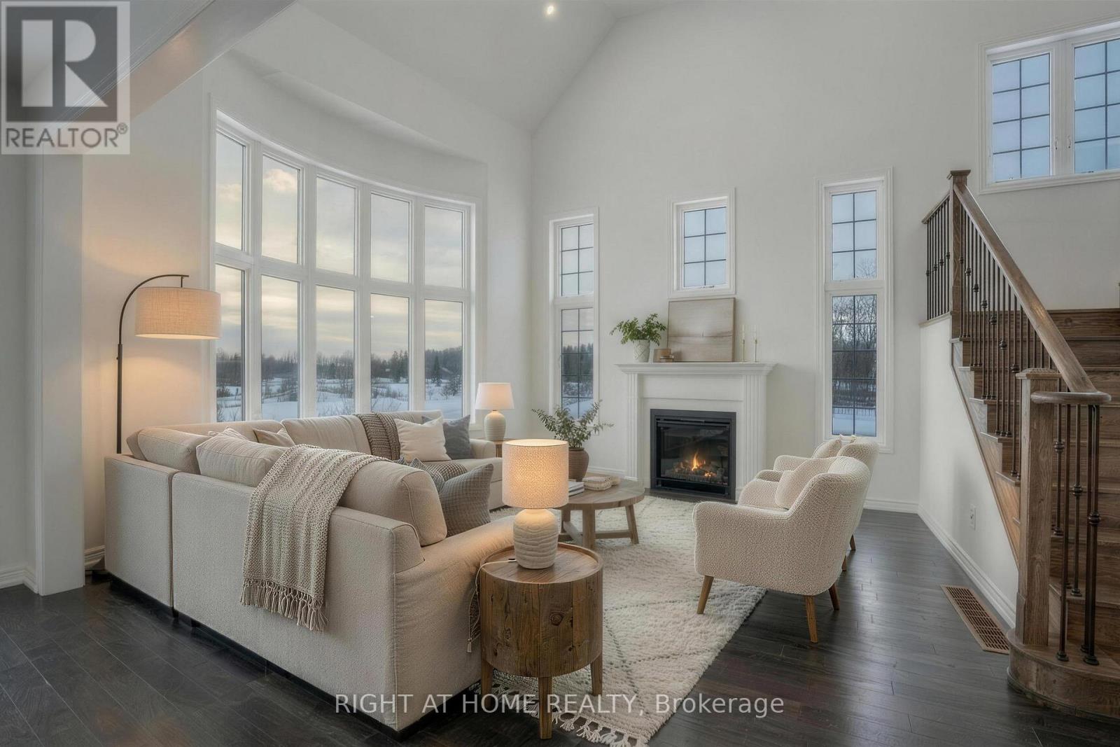 Living room — fireplace, large windows