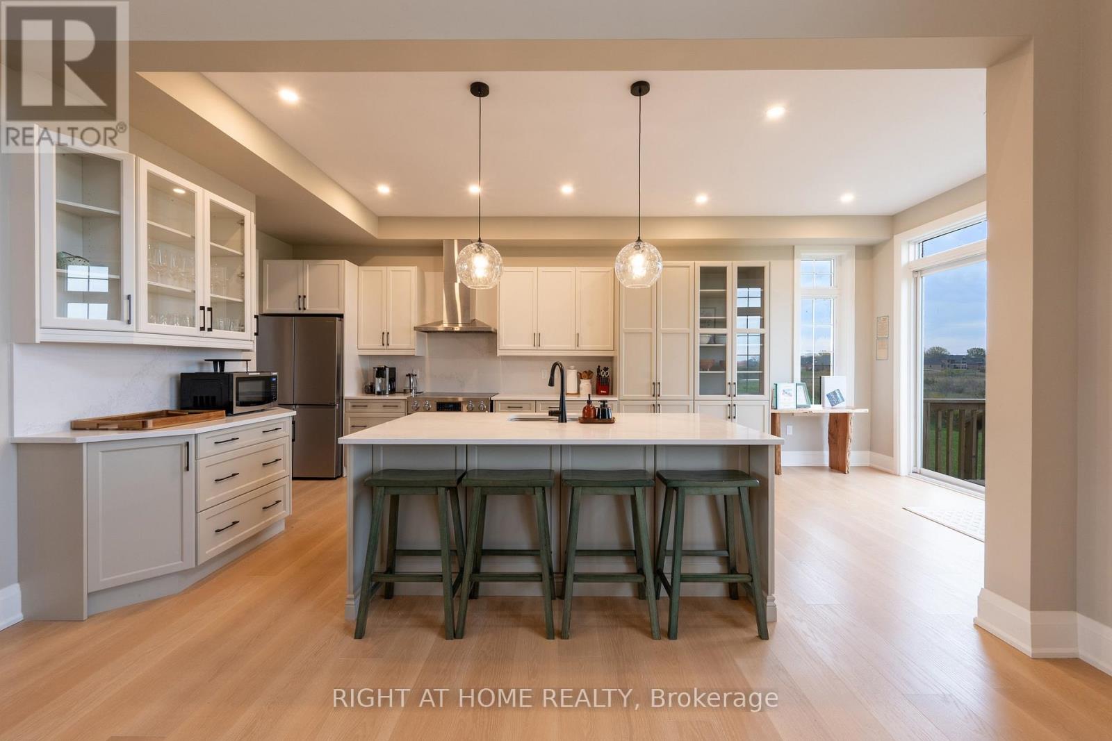 Kitchen — custom cabinetry, glass-front uppers