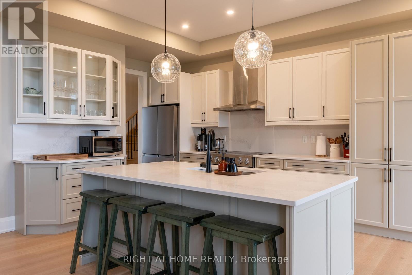 Kitchen — range hood, built-in cabinetry