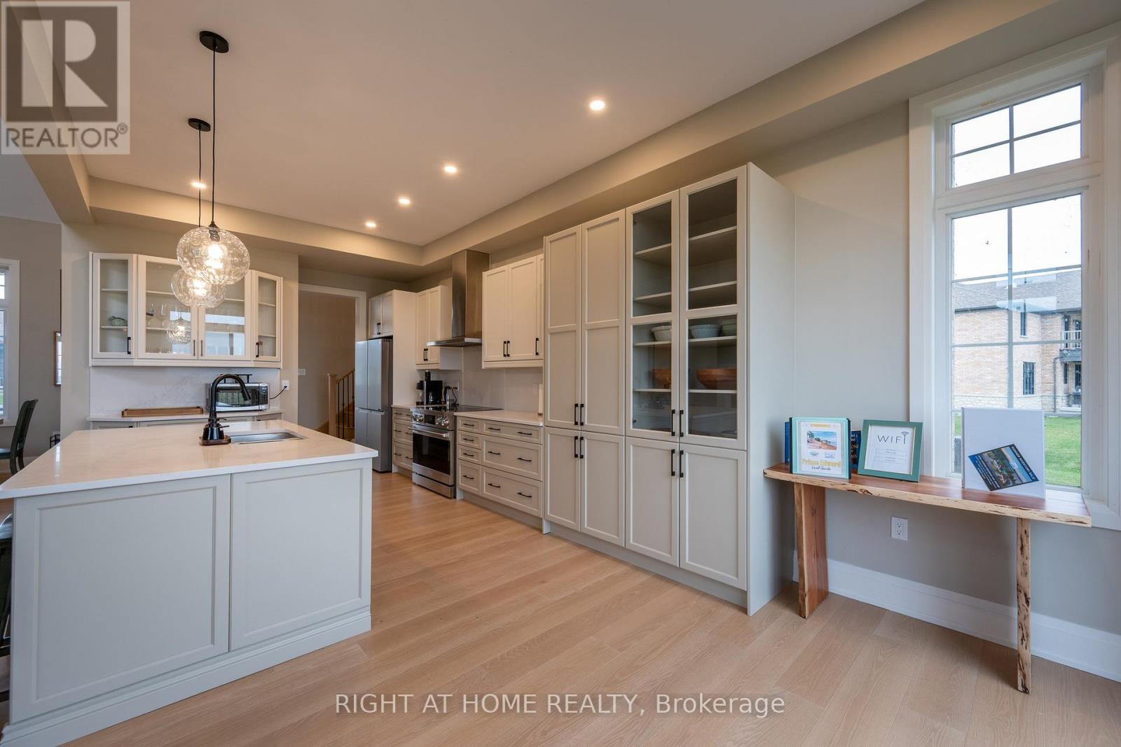 Kitchen and eating area — pendant lights, hardwood