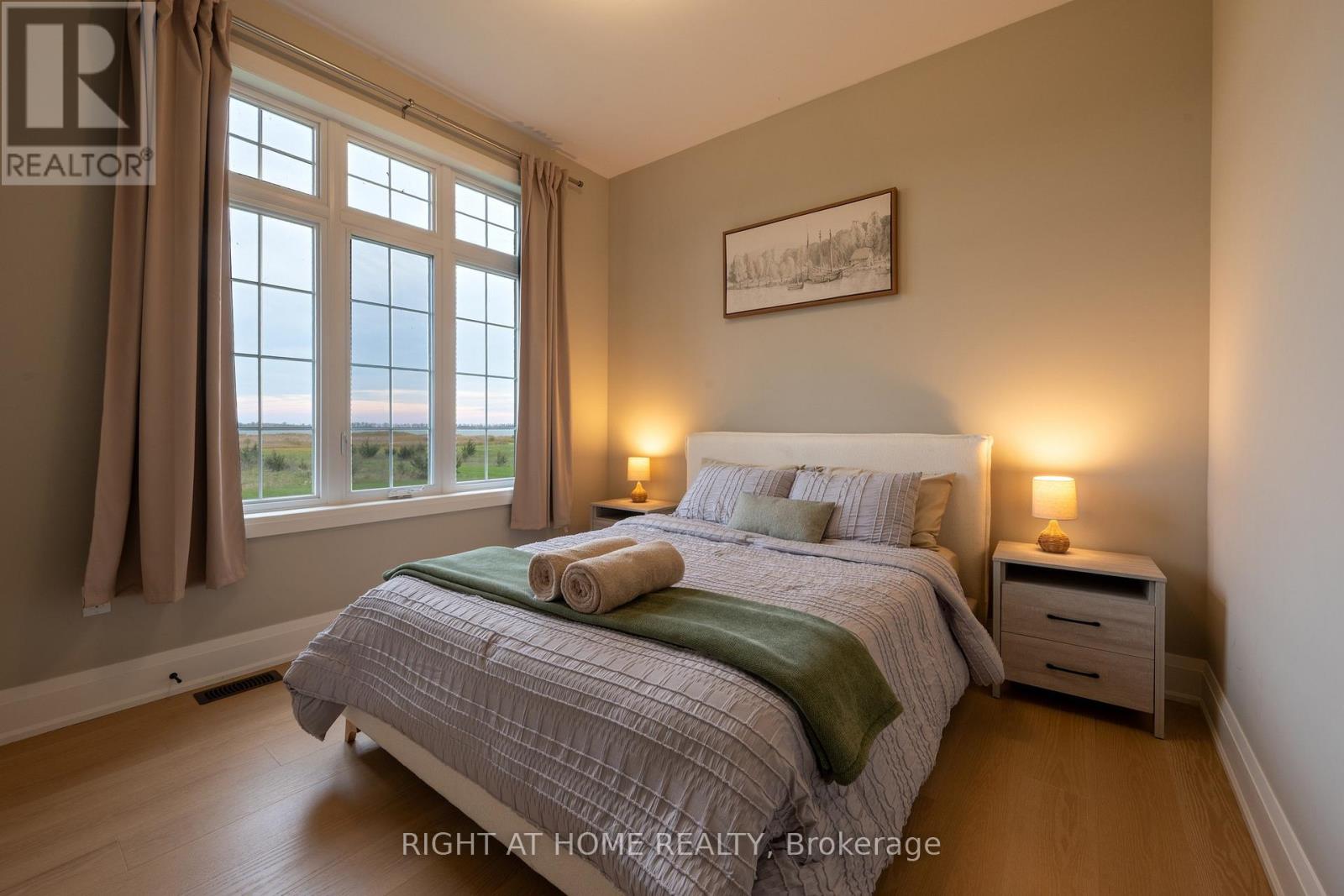 Bedroom 2 — green accents, countryside views