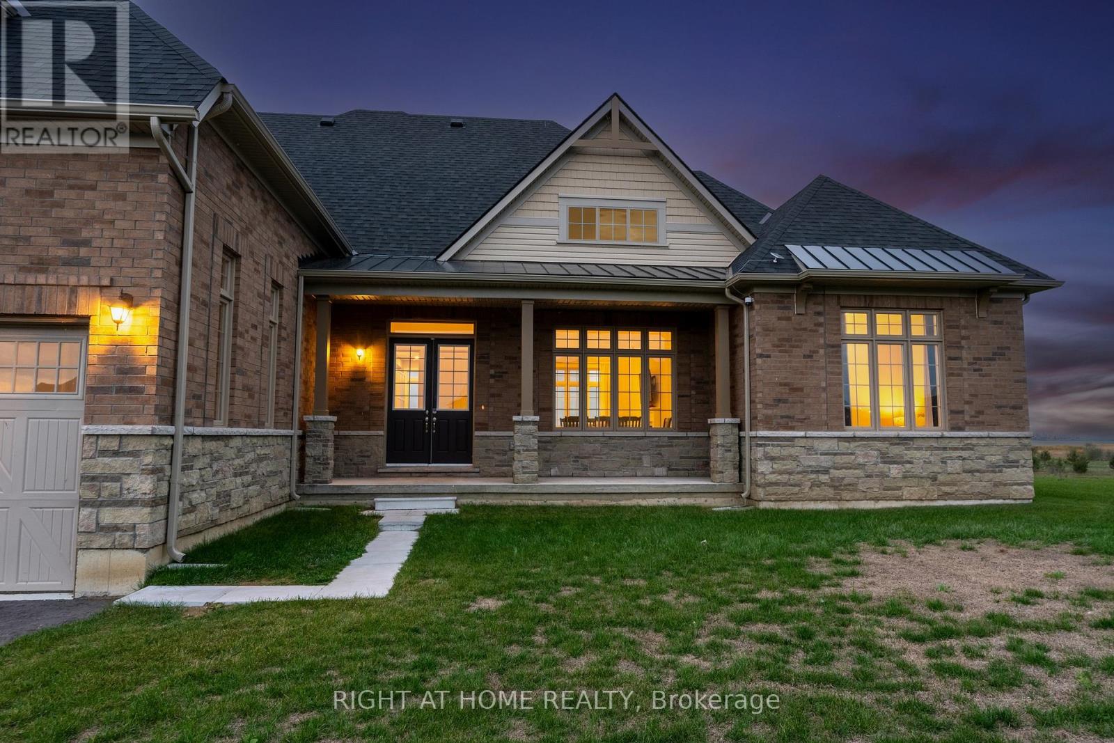 Front exterior — covered porch, stone accents