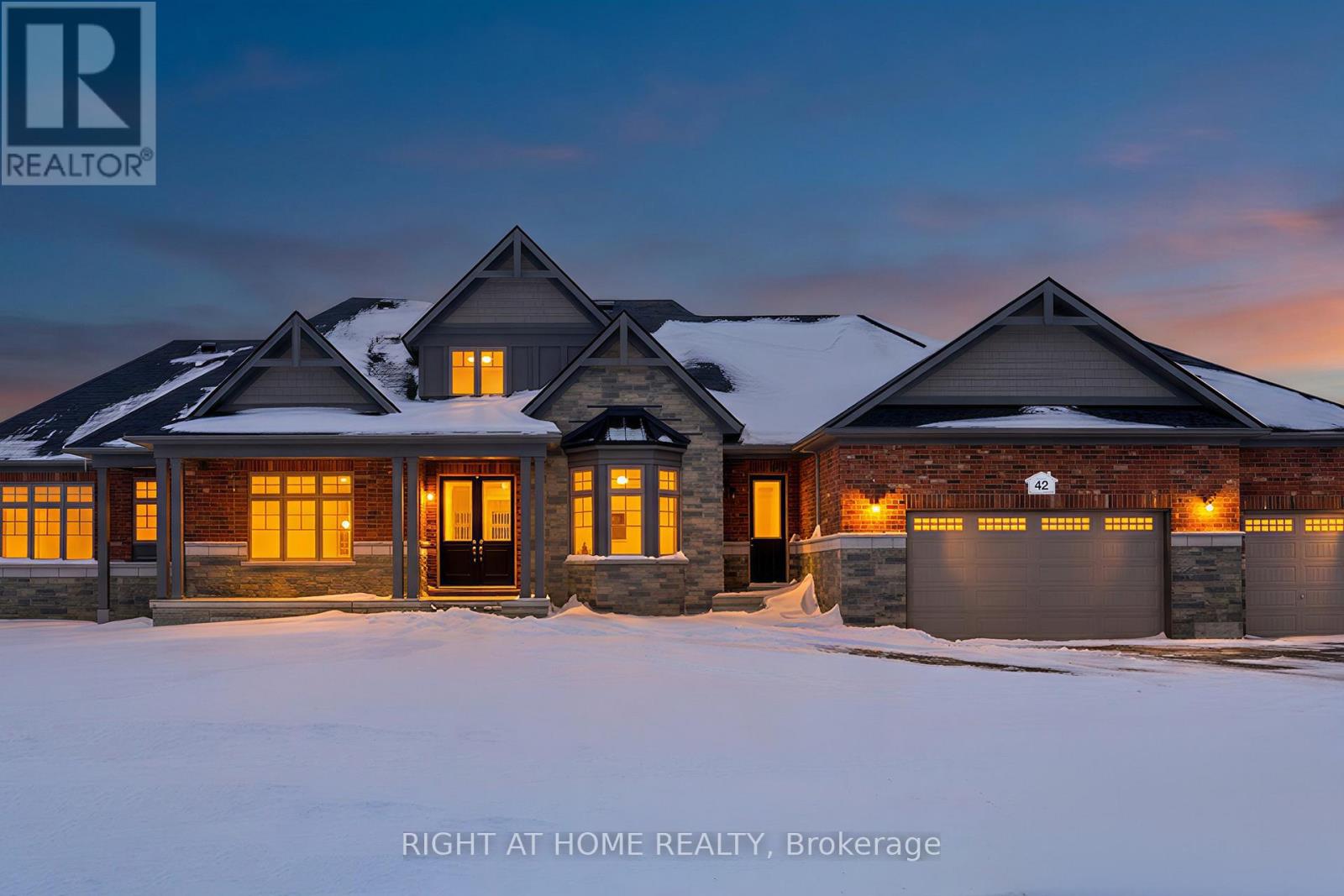 Front exterior — covered porch, triple garage
