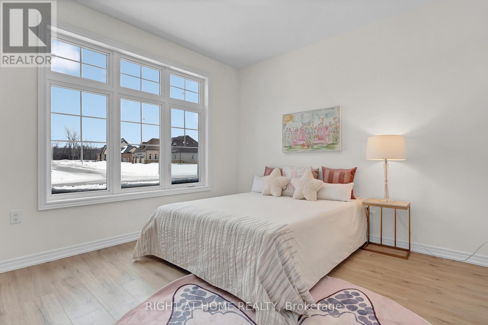 Bedroom 2 — hardwood, natural light