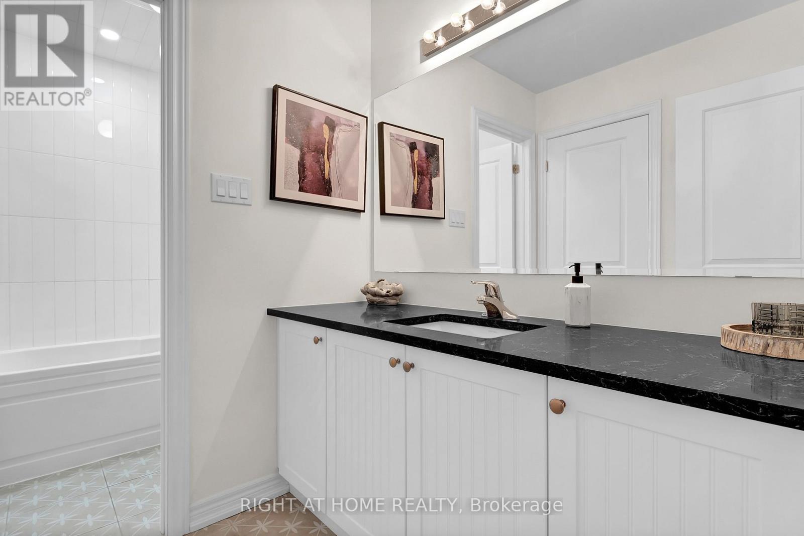 Bathroom — vanity, tile flooring