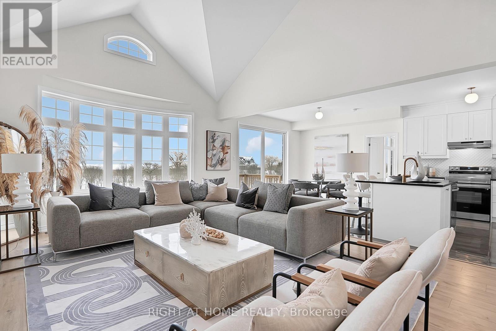 Great room — double-height ceiling, fireplace