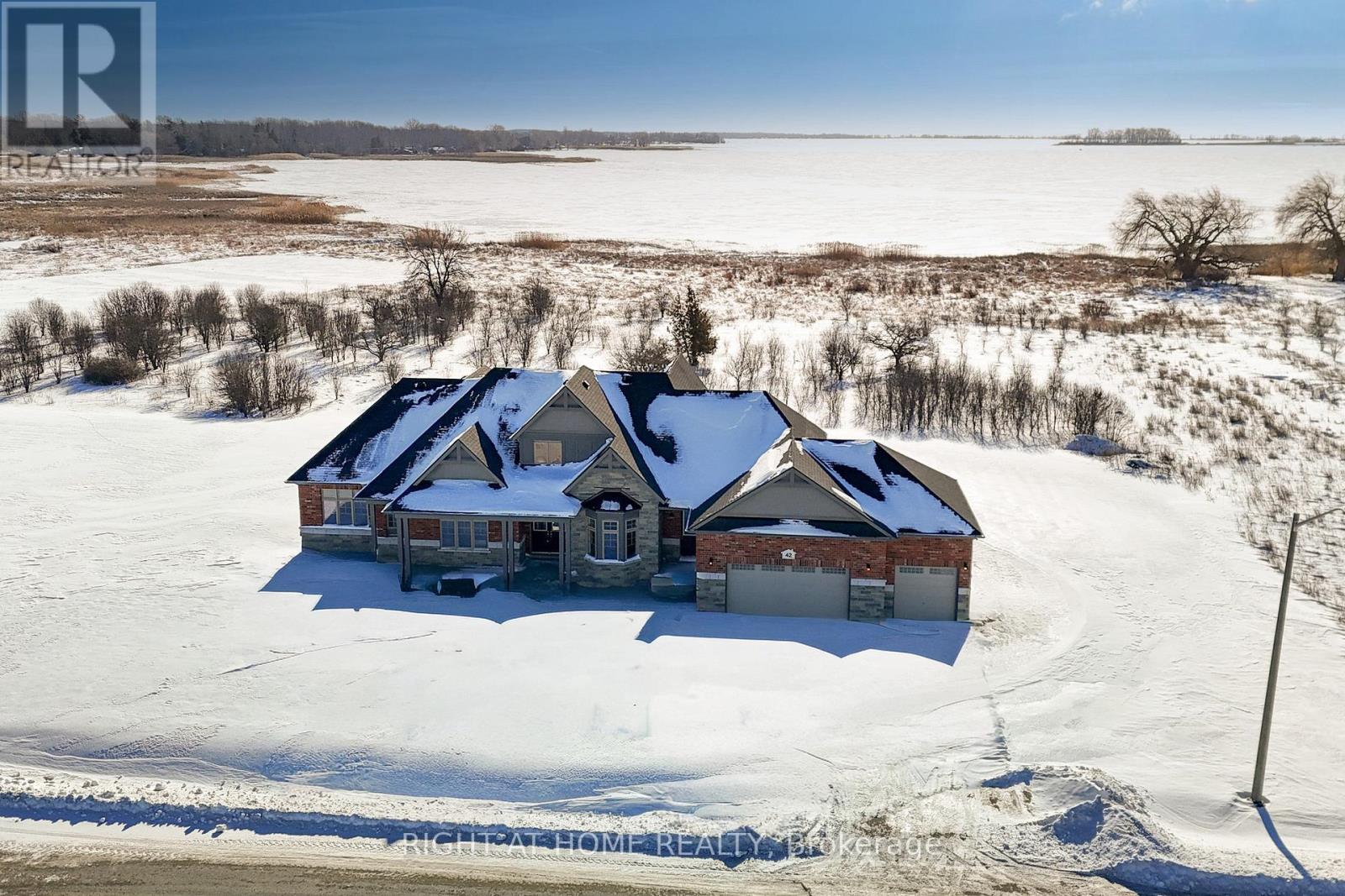 Aerial — property with lake behind