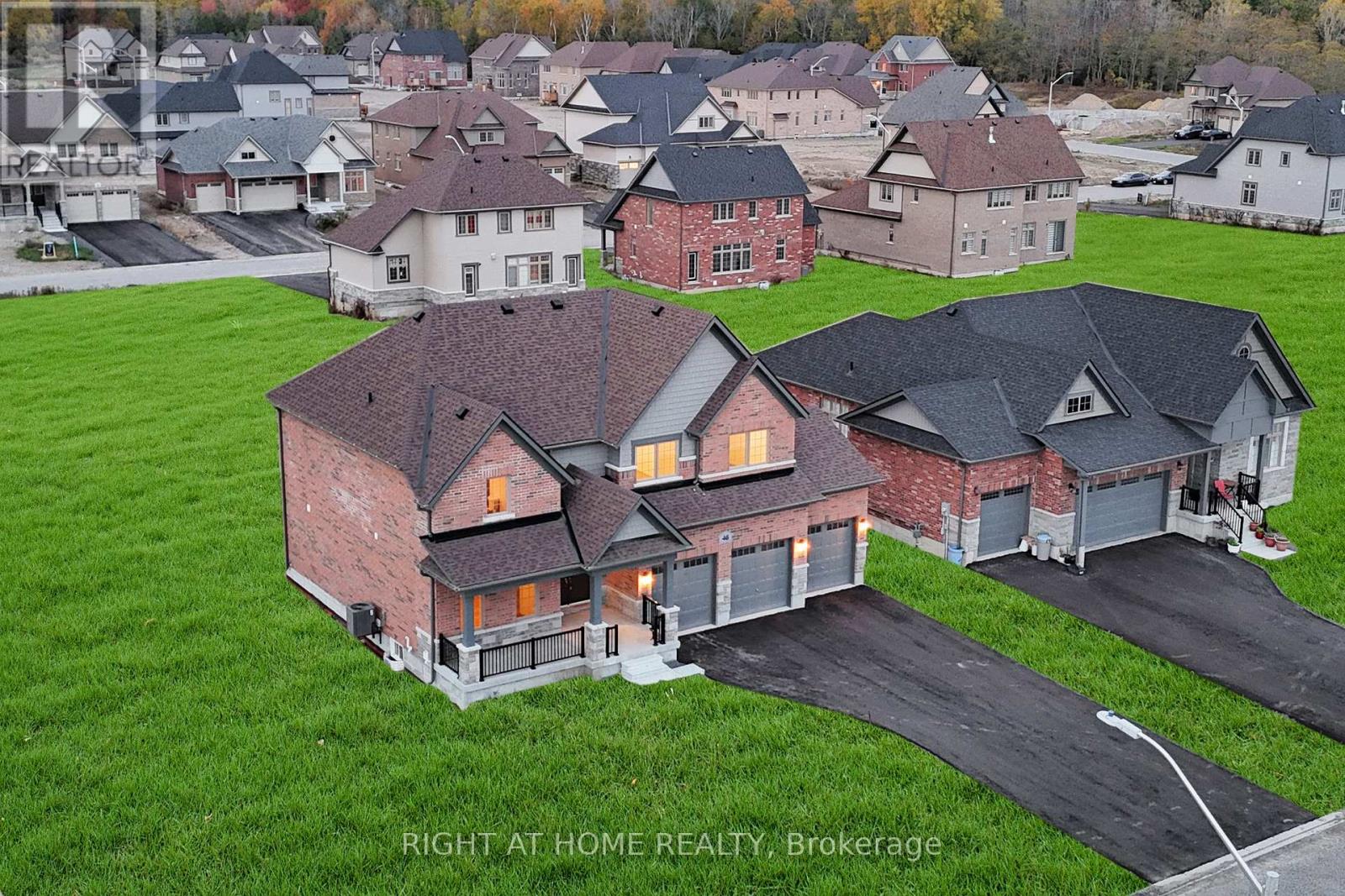 Front exterior — aerial at sunset