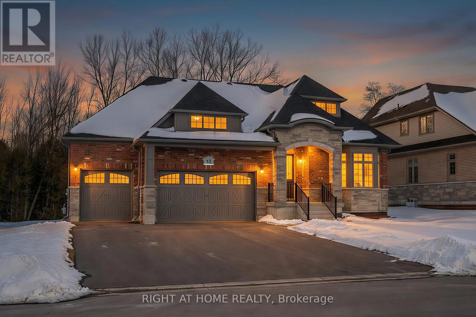 Front exterior — winter twilight with warm lighting