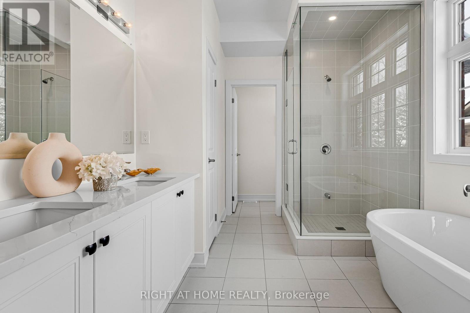 Primary ensuite — dual vanity, quartz counters