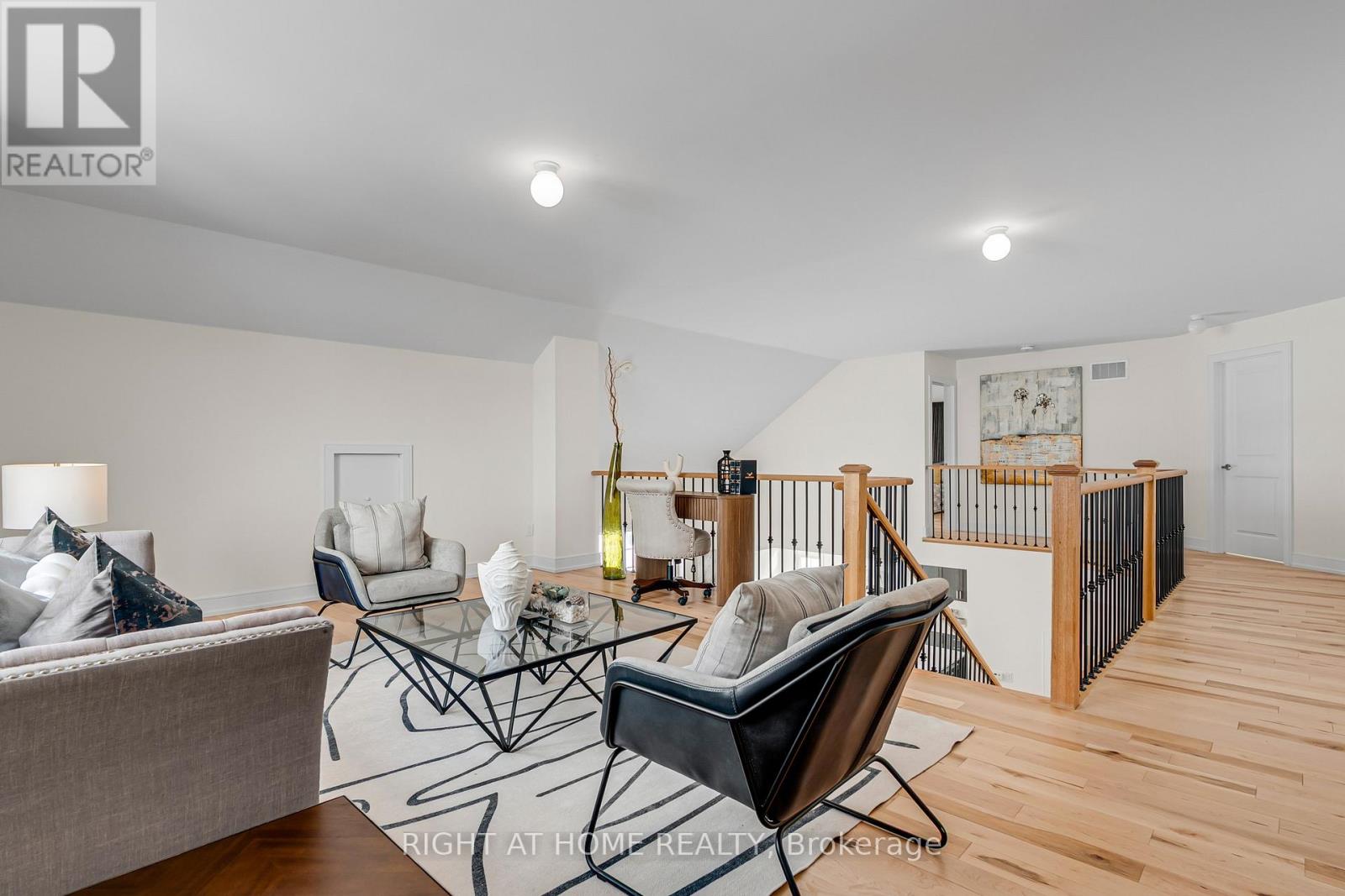 Upper level loft — staged as living area, 15' x 19'