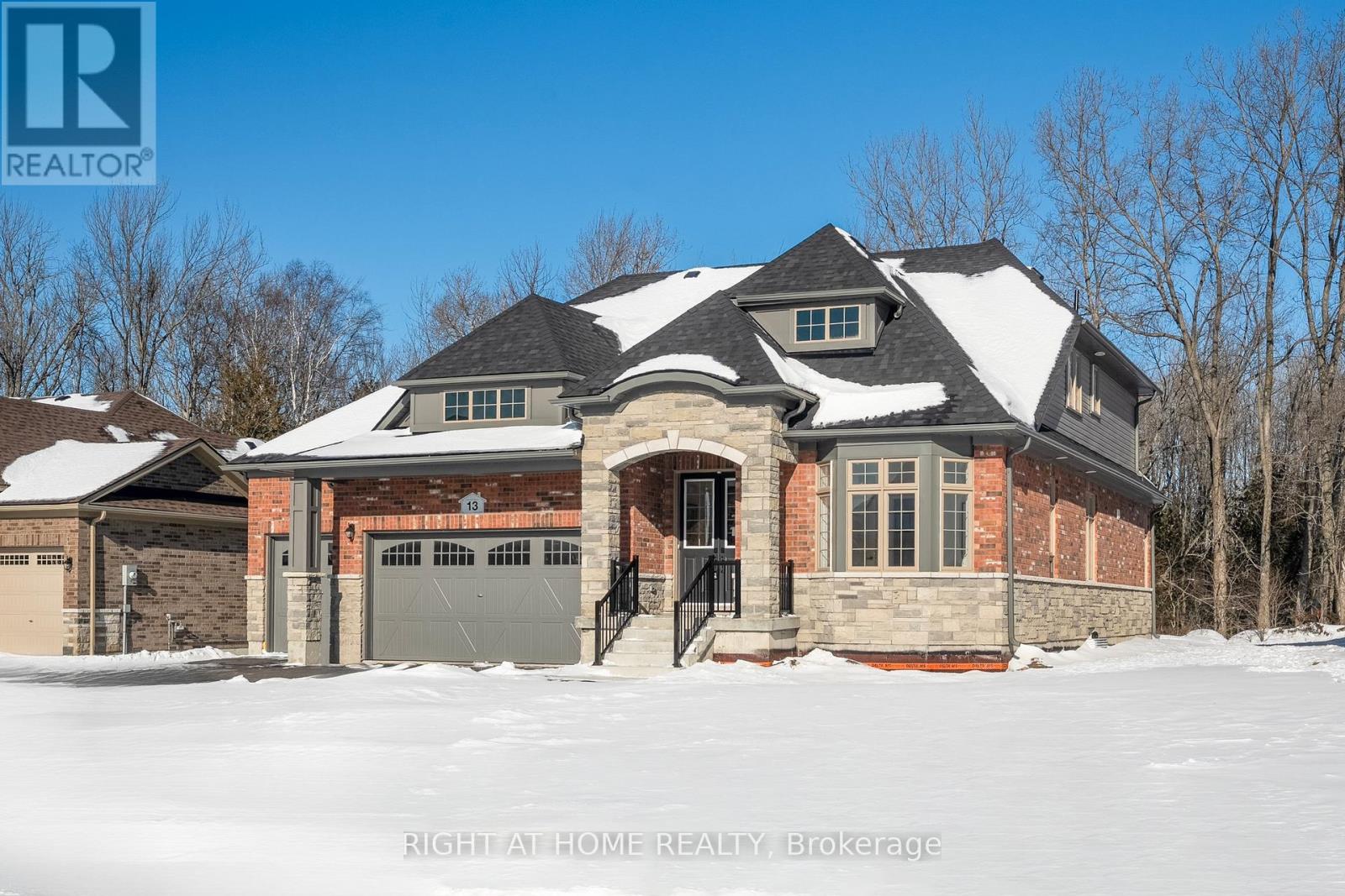 Front exterior — daytime winter view, brick and stone